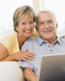 man on couch with woman behind